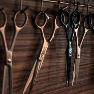 hairdressers scissors hanging from hooks